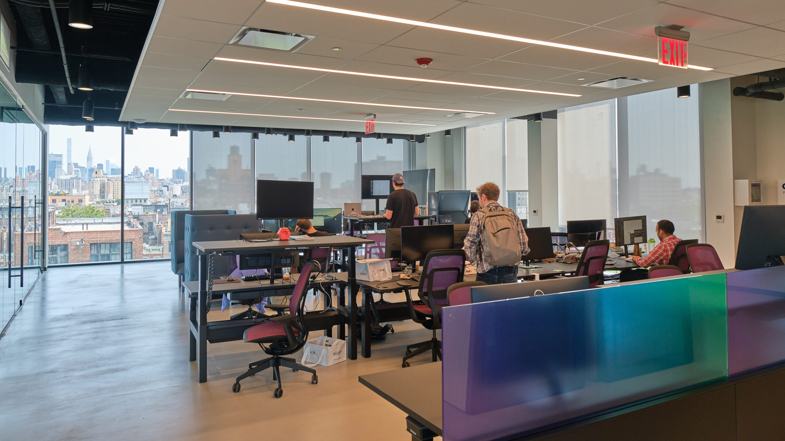 Solana HQ interior — open workspace with NYC skyline view